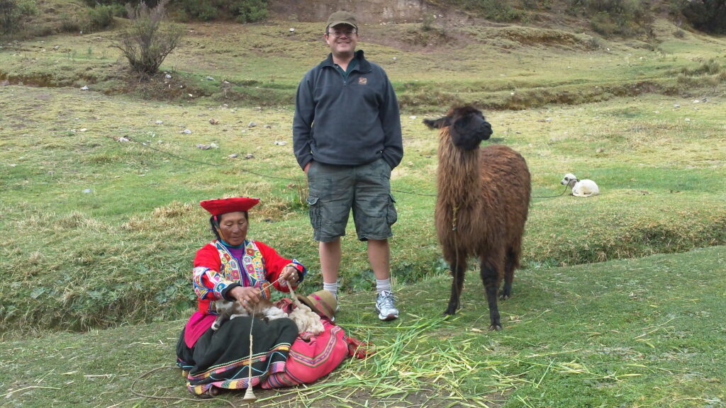 Woman and her Alpaca spinning wool.